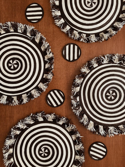 Adriana Castro Zenu Black and White Spiral Placemats and coordinating coaster set with Fringe Trim