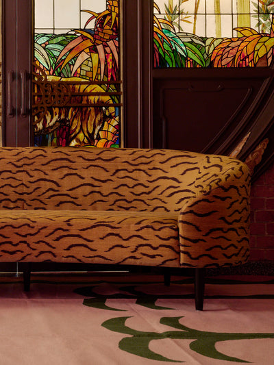Palma Rug and Upcycled Tiger Print Sofa at Haw Par Mansion