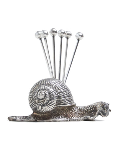 This vintage snail appetizer pick set will add a touch of whimsy to your next cocktail hour. Silver-tone. Wear consistent with age and imperfections should be seen as expected and character-adding.