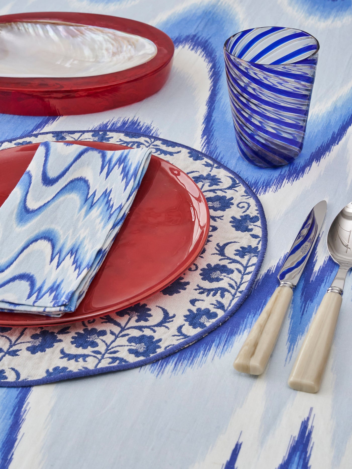 Aurora Flamestitch Tablecloth 260 cm and Napkins in Blue by Permanent Resident Suzani Placemat Sabre Nature Flatware Swirl Murano Glass Red Glass Dishware 